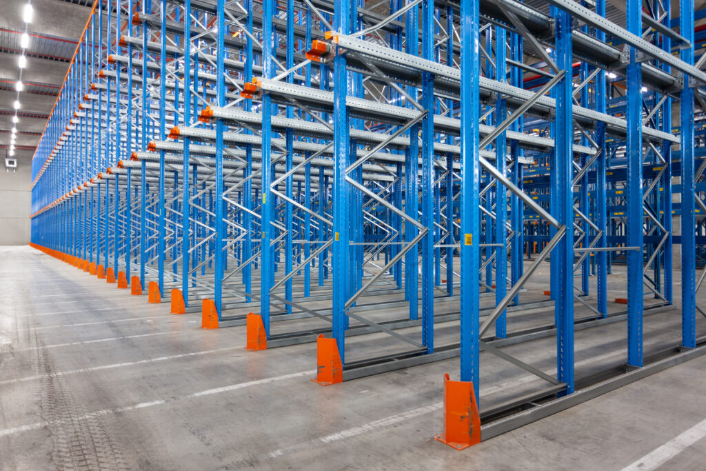 A,View,Of,Empty,Storage,Racks,In,A,Warehouse