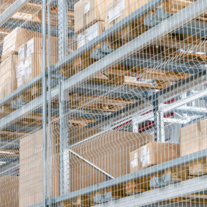 Large,Cardboard,Boxes,On,Shelves,Closed,Metal,Mesh,In,A