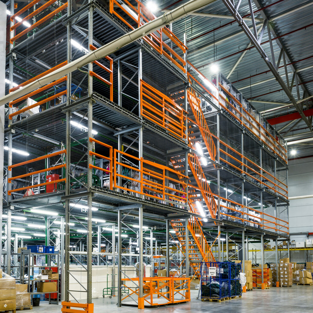 Mezzanine in modern warehouse, inside view of steel racks of mezzanine in large industrial storage. Interior of high warehouse of factory. Logistics and metal floors theme. Moscow - March 18, 2016