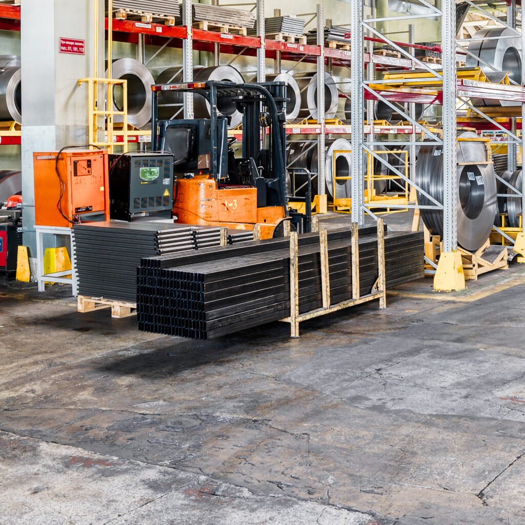 Factory warehouse steel reinforcement. High stacked shelving. Industrial distribution warehouse.